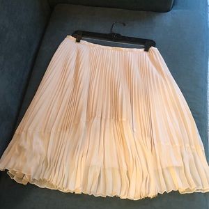 Cream colored pleated midi skirt. Size 8-10